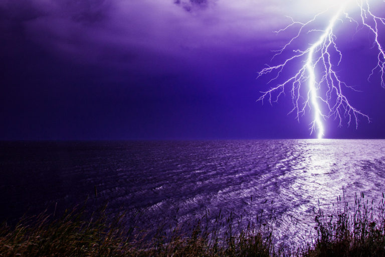 lightning ocean purple sky