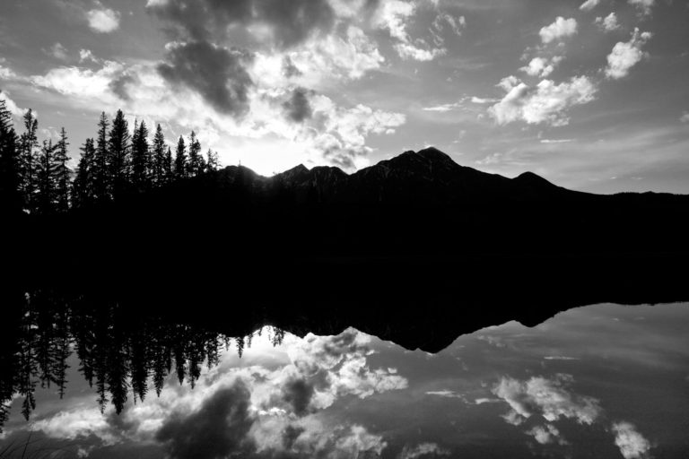 Black and white mountain lake sunset reflection