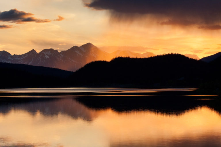 mountains lake sunset rain