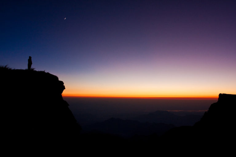 hiker sunrise moon mountains