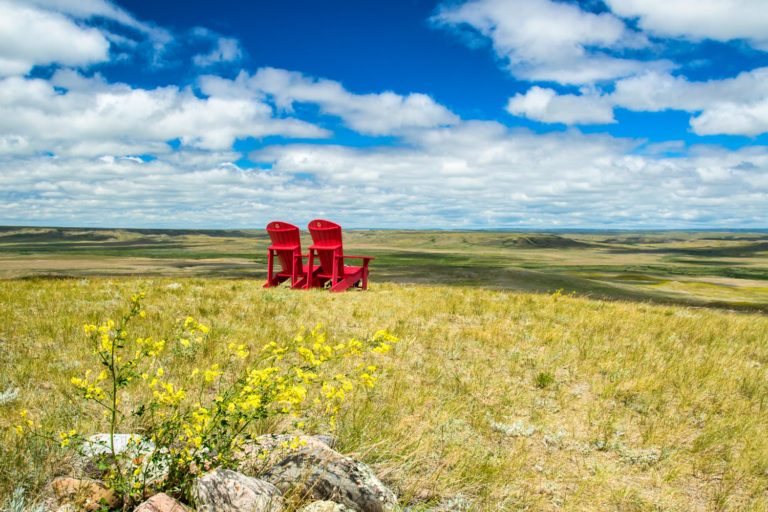 grasslands red chair blue sky