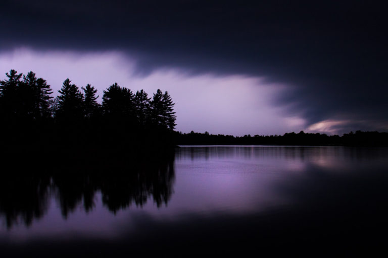 clouds storm lake trees purple