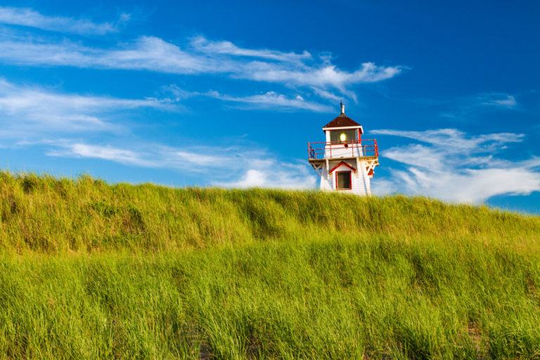 lighthouse dunes blue sky