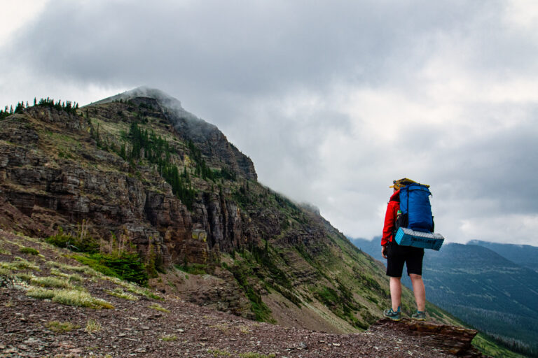 mountain hiker clouds