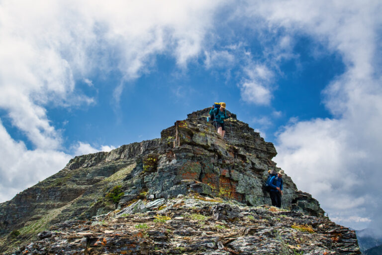 mountain hiker sky