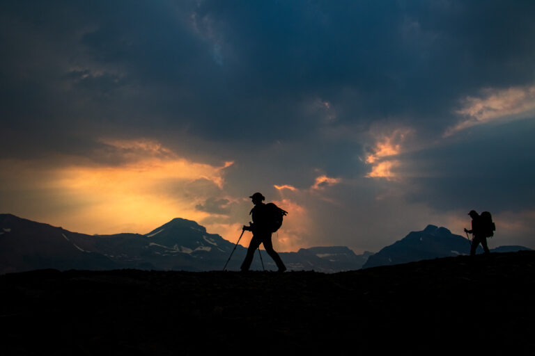 mountains hikers sunrise