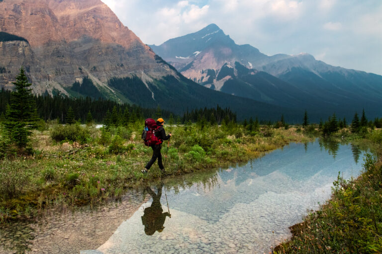 hiker mountains river