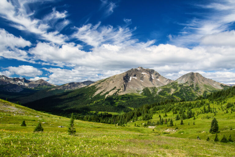 mountains meadow clouds